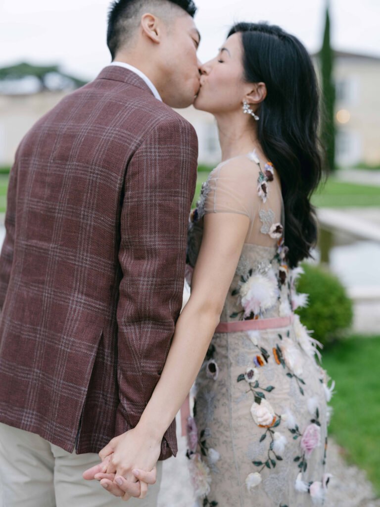 Chateau Gassies Engagement Couple Kiss Floral Gown Soft Overcast Light