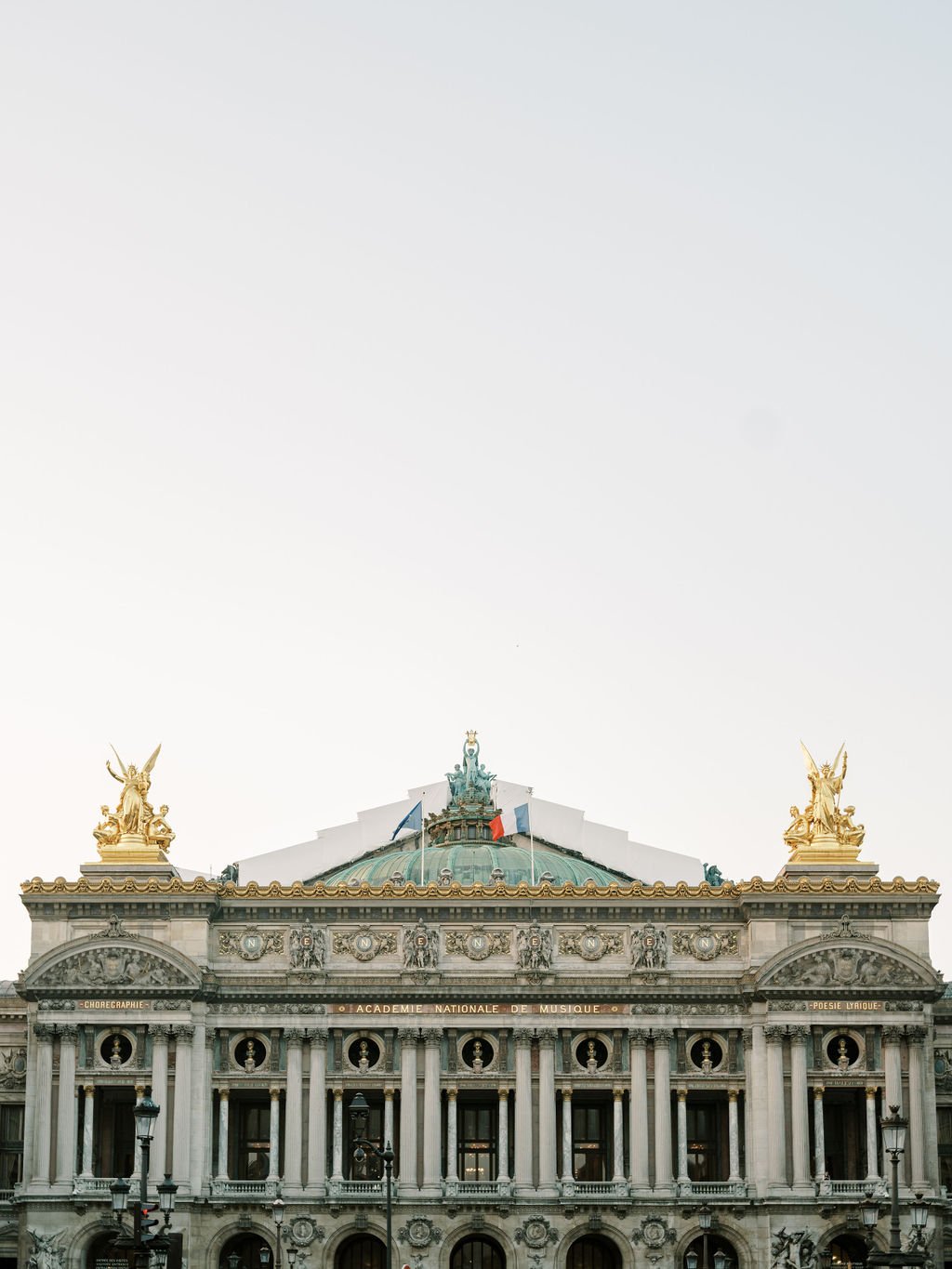 Golden statues and ornate architecture inside the Opera Garnier Paris, an intimate wedding venue
