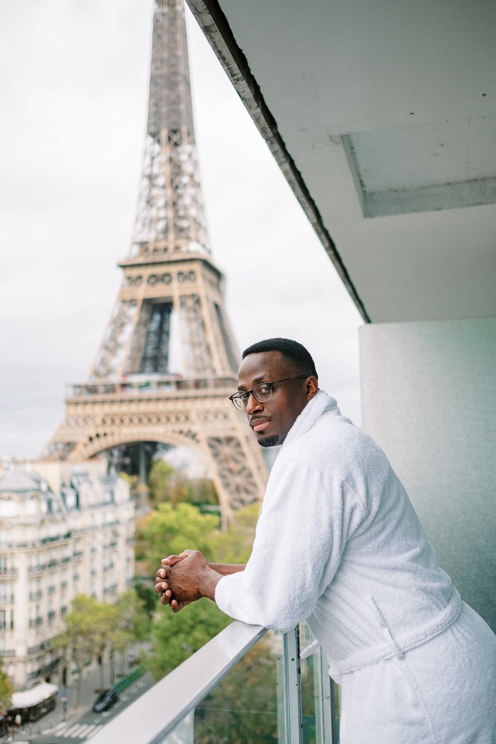 paris eiffel tower anniversary portraits groom balcony morning light contemplation