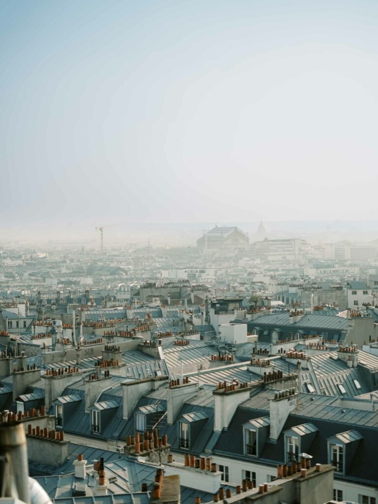 paris rooftops anniversary session zinc chimneys golden hour haze