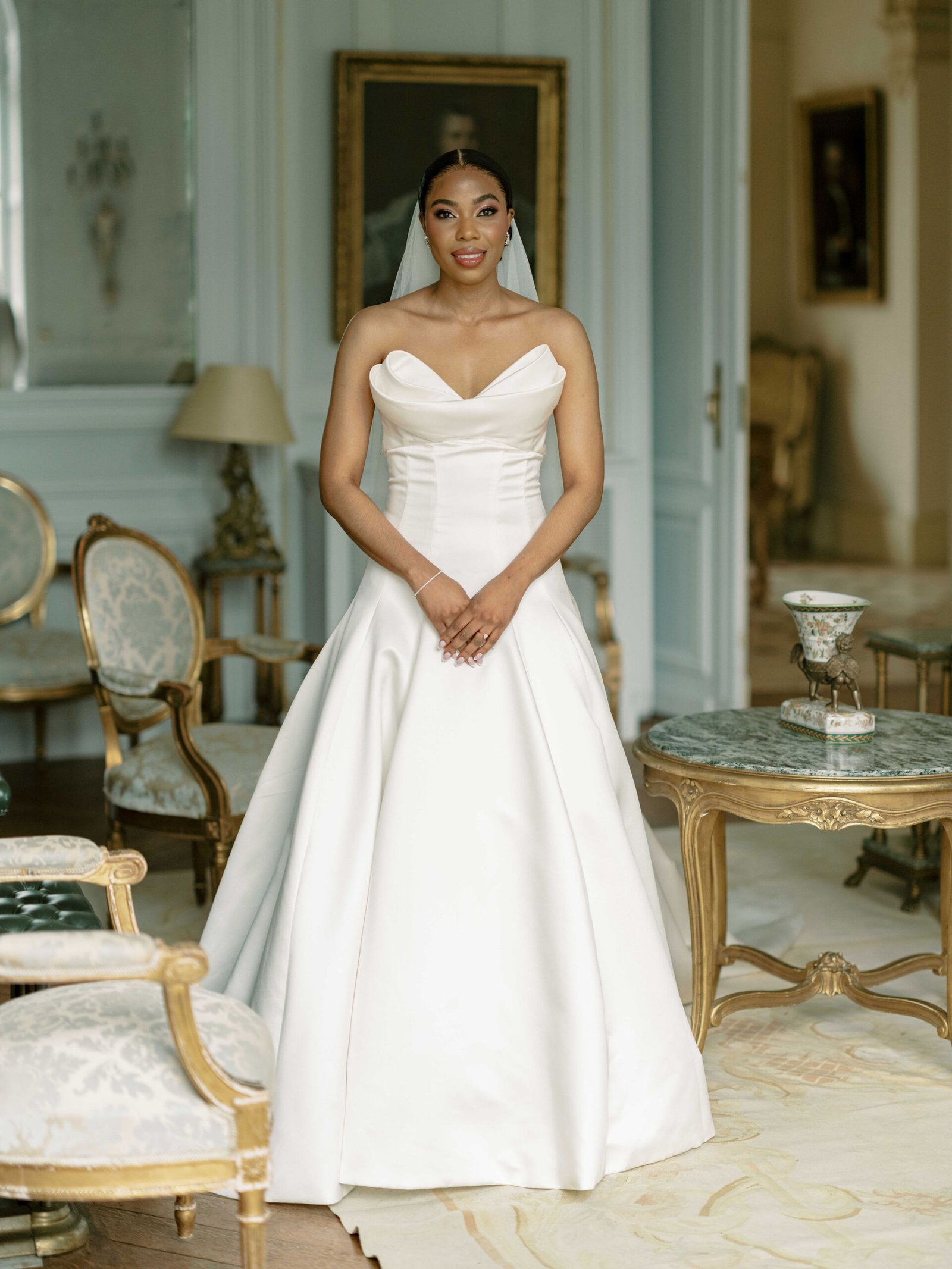 Bridal portrait in ballgown in the Louis XV salon at Château de la Durantie during golden hour