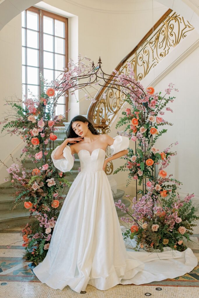 Chateau De Laile Bridal Portraits Off Shoulder Gown Floral Arch Staircase