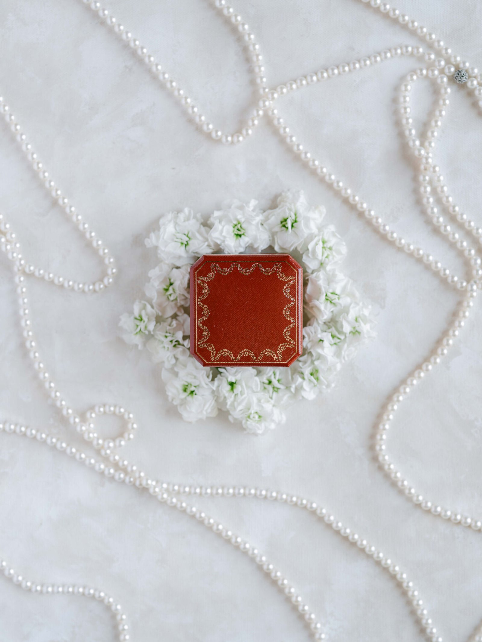 Cartier ring box with pearls and white flowers, luxury wedding details