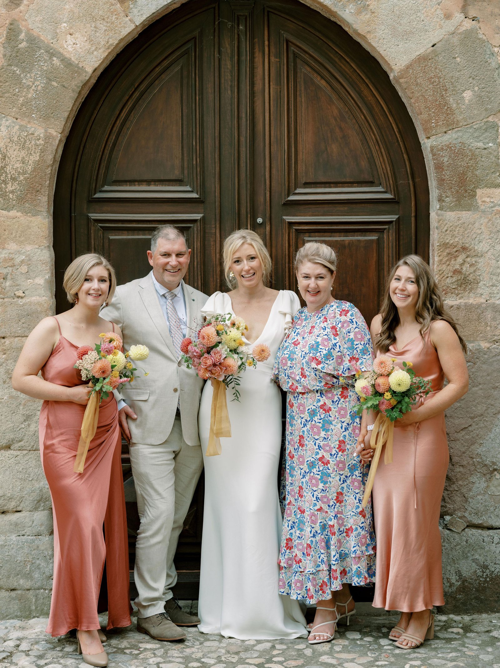 Family formals portrait in arched doorway at Chateau Sainte Roseline Provence during soft evening light