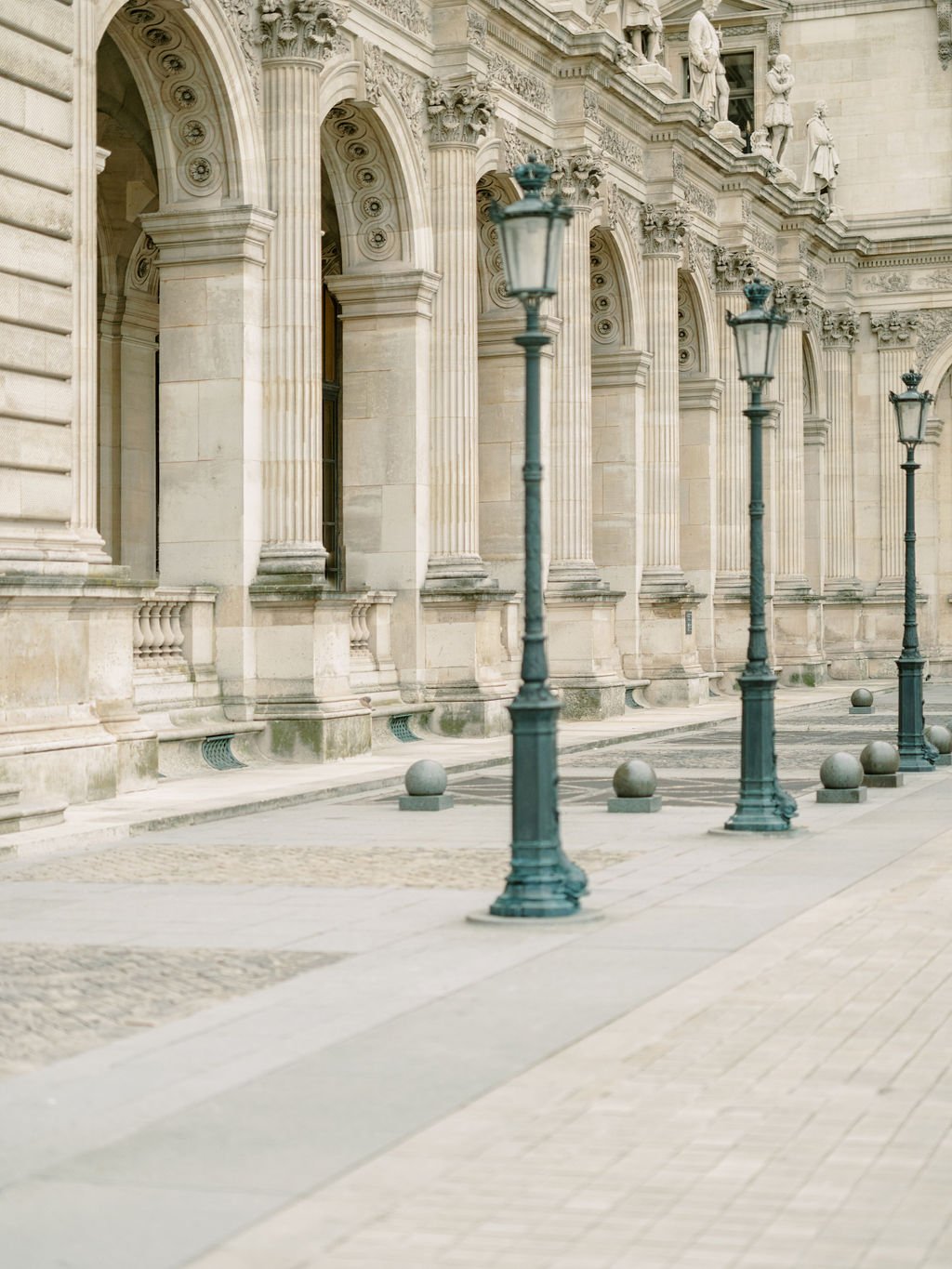 Morning light at the Louvre colonnade Perrault, one of the best Paris engagement session locations