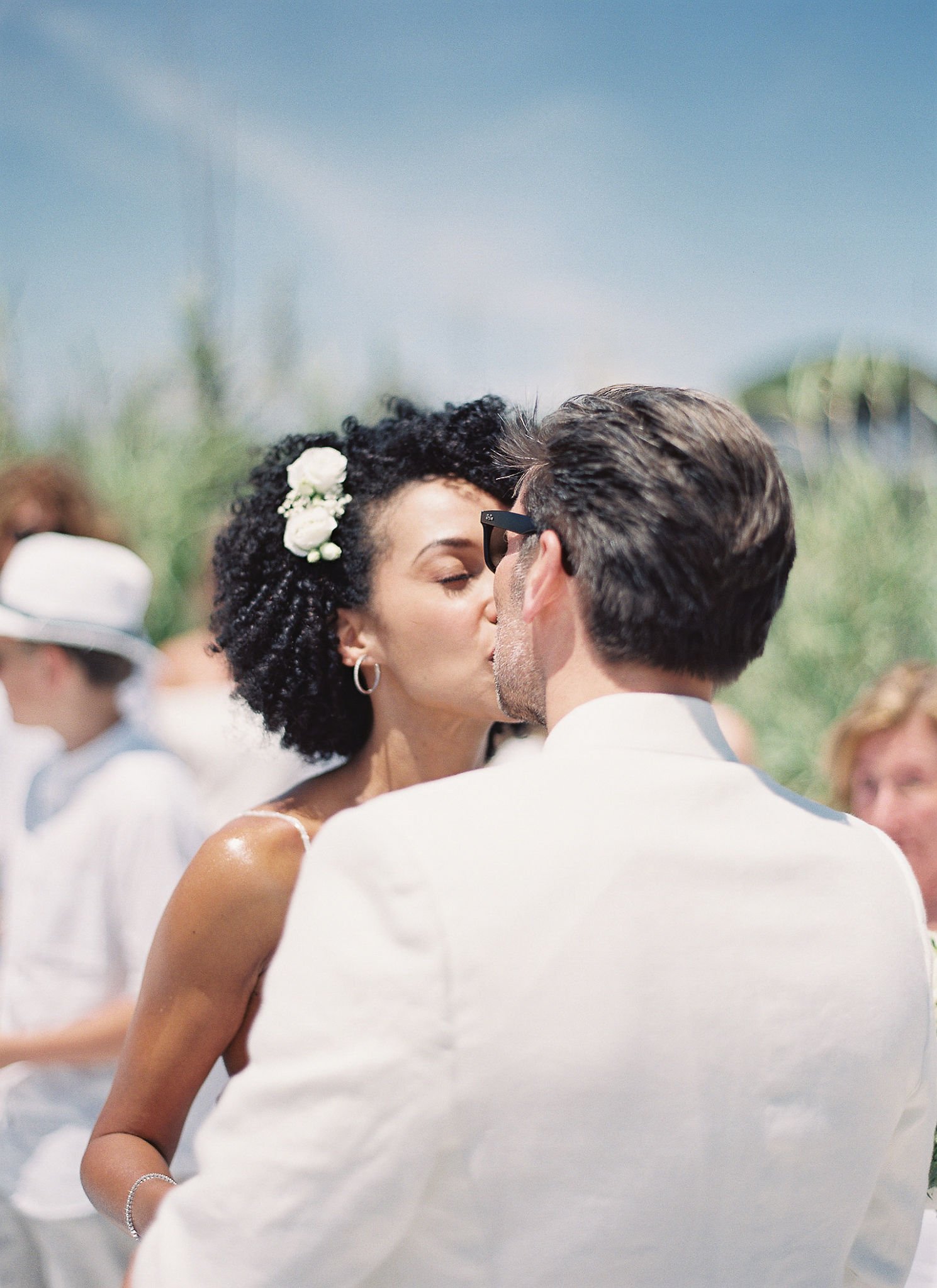 Couple sharing their first kiss as newlyweds at Pan Deï Palais Saint-Tropez ceremony in golden hour light