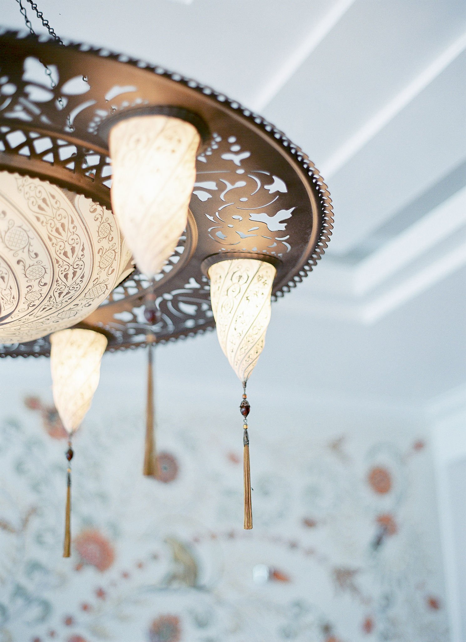 Ornate Moroccan-style brass chandelier with intricate metalwork at Pan Deï Palais luxury hotel in Saint-Tropez