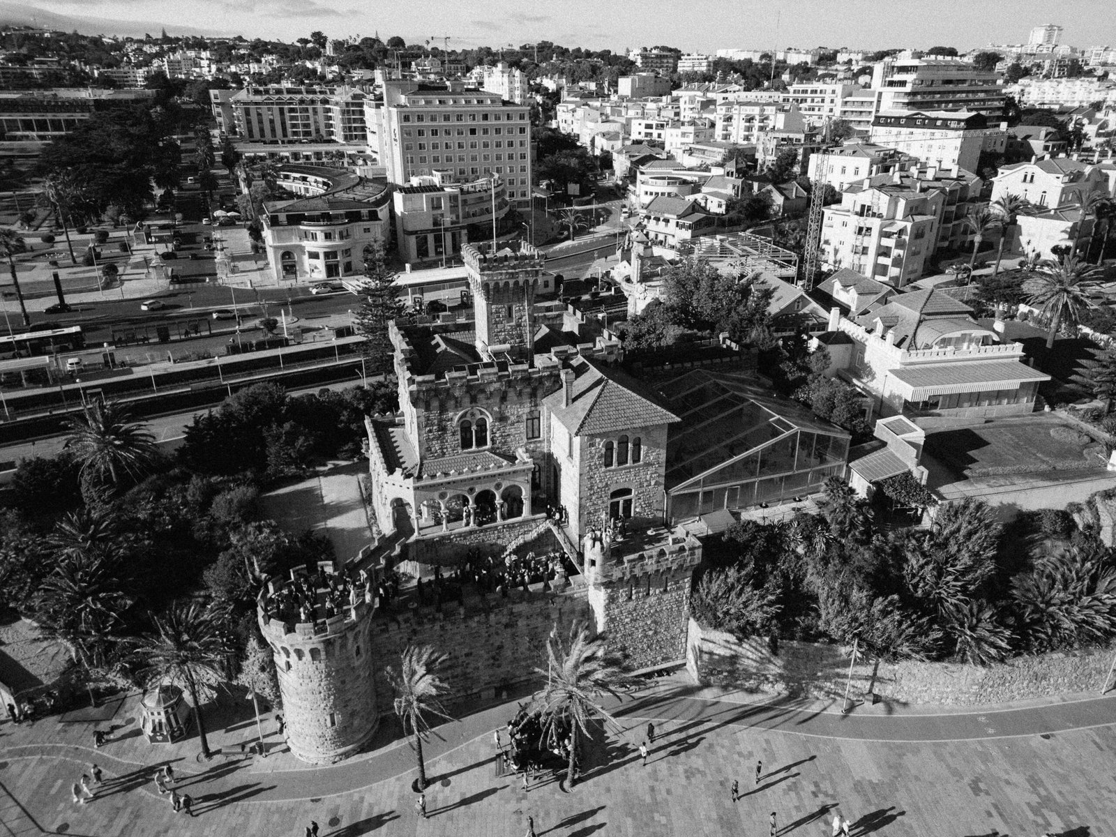 Aerial view of Lisbon at dusk with São Jorge Castle above the city rooftops