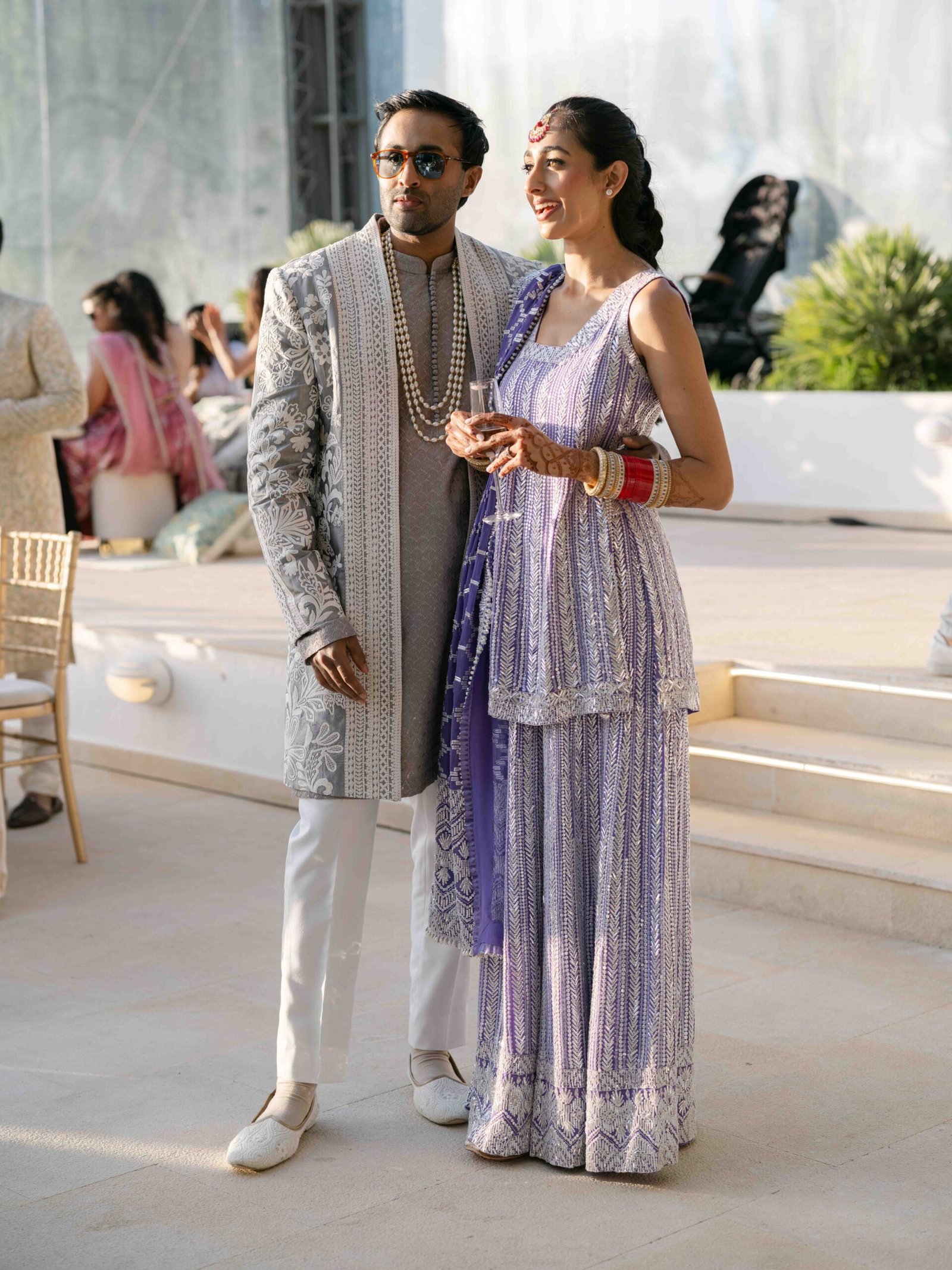 Indian couple at the cocktail hour in Lisbon, the bride in a lavender lehenga, golden hour