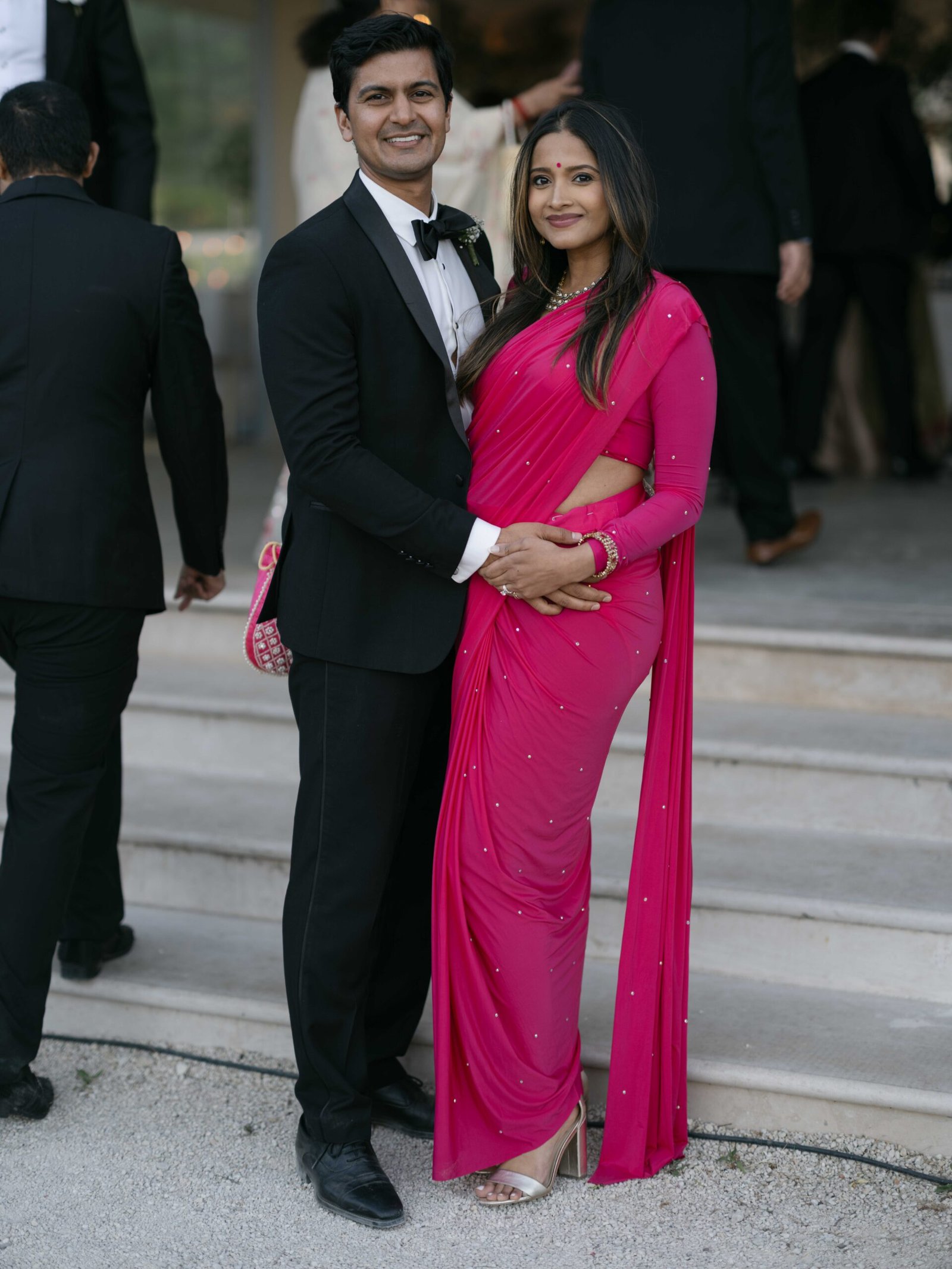 Couple at the wedding reception in Lisbon, the bride in a fuchsia sari