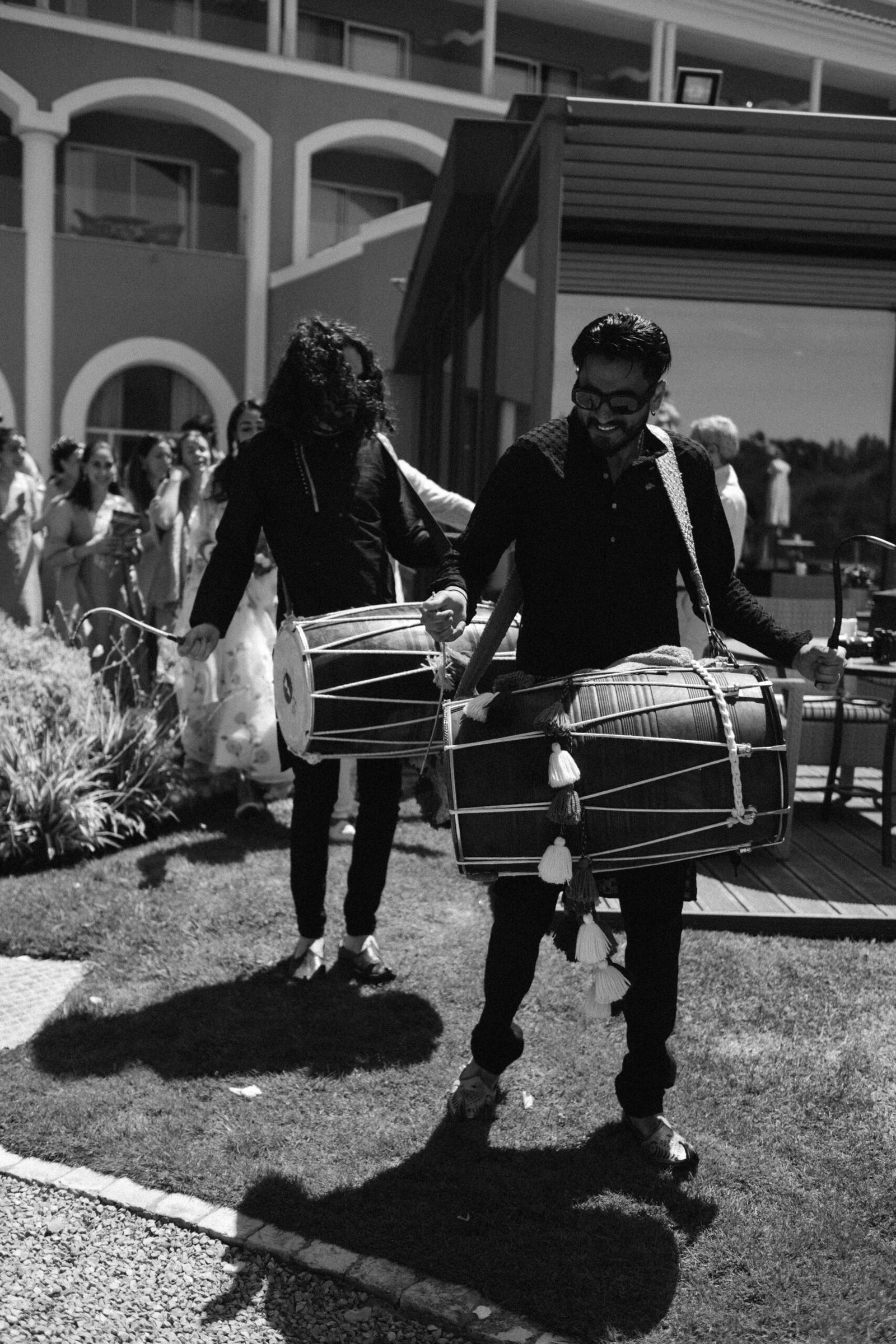 Groom and groomsman playing drums during the wedding celebrations in Lisbon