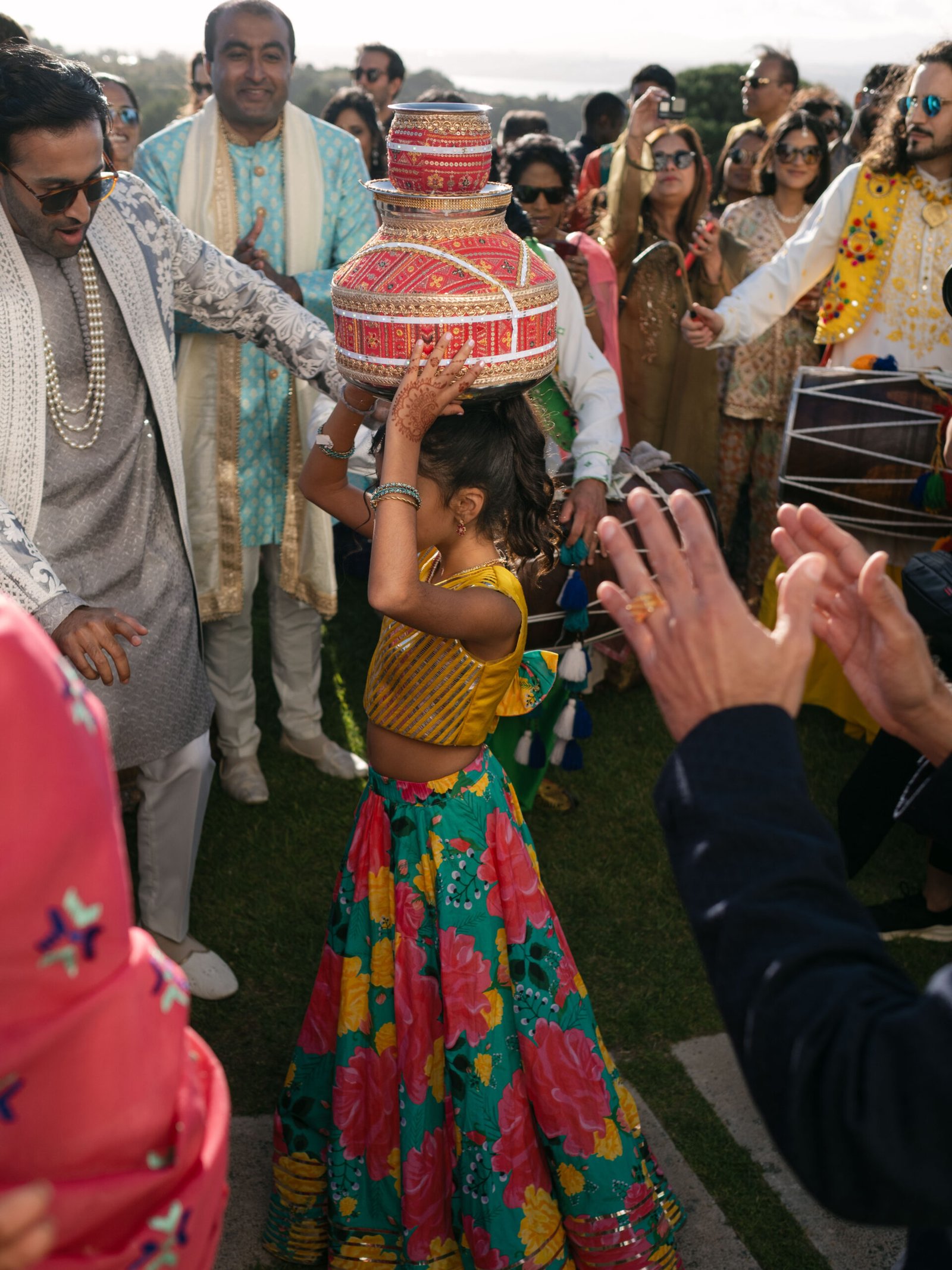 Child dancing during the baraat at an Indian wedding in Lisbon, golden hour