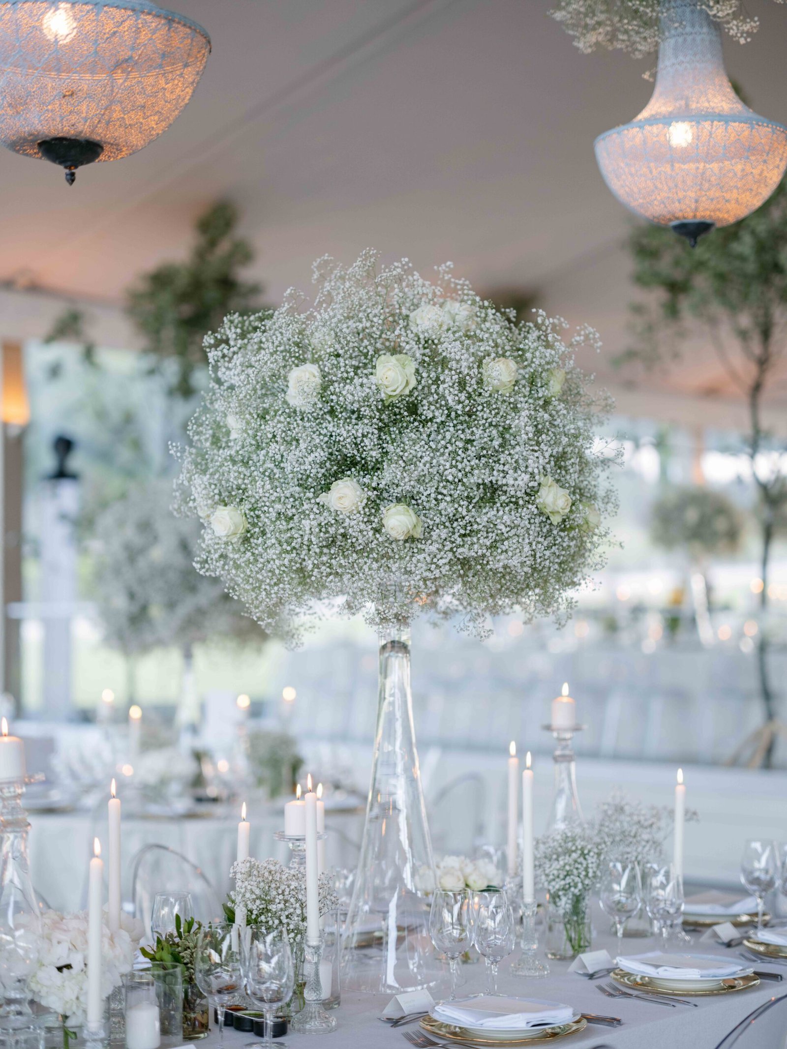 Baby's breath centerpiece and candlelight on a reception table in Lisbon